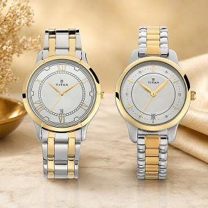 Two Titan wristwatches with silver and gold-tone links displayed on a beige background (left with Roman numerals, right with simple markers).