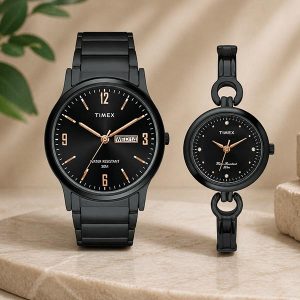 Pair of black Timex watches—a men’s stainless steel watch and a matching women’s bracelet watch on a beige surface.