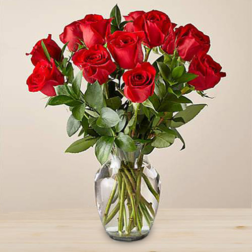 12 red roses in a glass vase