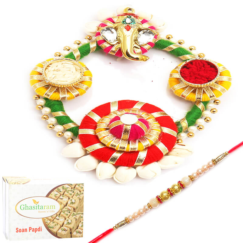 Colourful Acrylic Pooja Thali with Rakhi and Soan Papdi