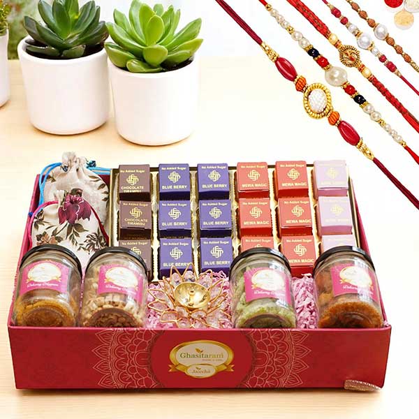 Big Pink tray of Sugarfree bites, Mewa Bites Anjeer Bites, Dryfruits Namkeen and Diya with 5 Rakhis