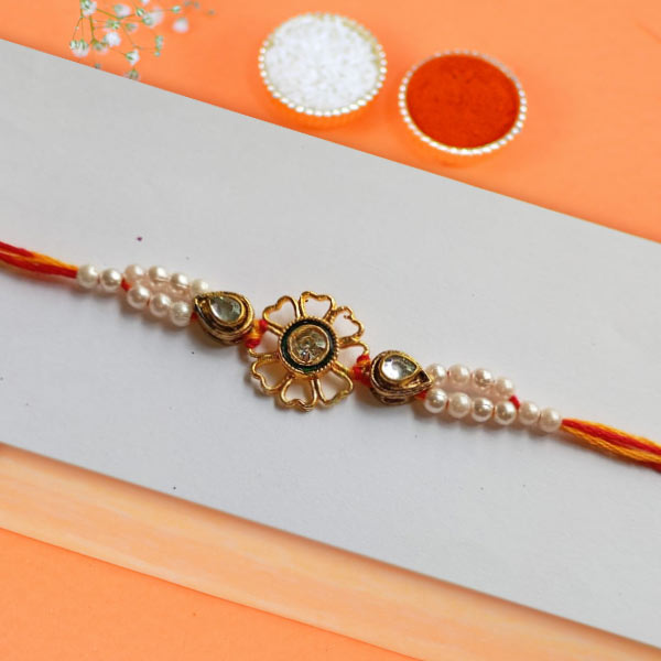 Sleek Golden Floral Pearl Beads Rakhi